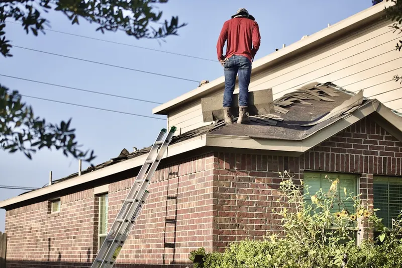 Professional roofer working on a residential roof in Heatherfield Acres
